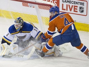 St. Louis Blues goalie Brian Elliott (1) makes the save on Edmonton Oilers' Taylor Hall (4) during third period NHL action in Edmonton, Alta., on Thursday October 15, 2015.