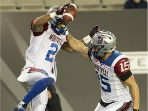 Montreal Alouettes slotback Fred Stamps (2) celebrates his touchdown with teammate Samuel Giguere during a CFL game at Hamilton on Oct. 23, 2015.