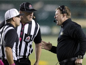 Edmonton Eskimos head coach Chris Jones talks to the officials during a Canadian Football League game against the B.C. Lions at Commonwealth Stadium on Oct. 17, 2015.