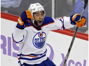 Edmonton Oilers' Darnell Nurse celebrates his first goal in the third period of an NHL hockey game against the Minnesota Wild, Tuesday, Oct. 27, 2015, in St. Paul, Minn. The Wild won 4-3.