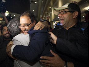 Amarjeet Sohi celebrates his victory Monday in Edmonton Mill Woods.