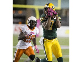 Edmonton Eskimos' Kenny Stafford (7) catches the ball as B.C. Lions Steven Clarke (29) watches during second-half CFL action at Commonwealth Stadium on Oct. 17, 2015.