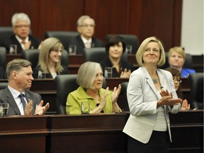 Premier Rachel Notley and her caucus applaud following the swearing-in ceremony in the Alberta Legislature in June.  The fall session opens Monday.