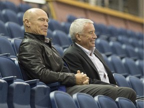 Former Oilers captain Mark Messier and Bob Nicholson, Oilers chief executive sit together to watch the team's morning skate at Rexall Place on Oct. 1, 2015.