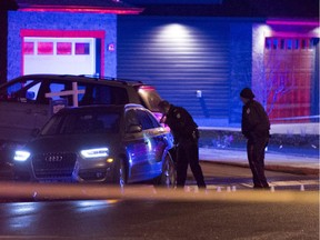 Edmonton police have a section of residential road in the south Edmonton community of Windermere blocked off to investigate a crime scene involving a parked Audi.