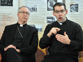 This Dec. 7, 2012 file photo shows Archbishop Richard Smith, left, with Father Matthew-Anthony Hysell, the first ordained deaf priest of the Catholic church in Canada.