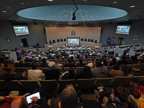 EDMONTON, ALBERTA, JUNE 2, 2015: People filled City Council Chambers to watch the Truth and Reconciliation Commission's release of its final report on Indian Residential Schools, live from Ottawa, in Edmonton on Tuesday Jun 2, 2015.