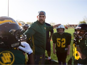 Ryan King of the Edmonton Eskimos organizes his group during the Eskimos amateur football camp at Clarke Field on May 11, 2015.