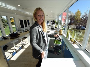 Brand ambassador Kim Morey demonstrates the Smart Cooktop, as Telus opened a 560-square- foot Future Home that showcases technology such as facial-recognition entry system and a gesture-controlled kitchen that high-speed fibre-optic Internet will make possible, in the Telus World of Science parking lot in Edmonton on Thursday ,Oct. 1, 2015.