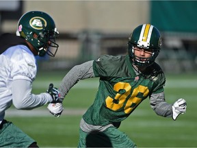 Edmonton Eskimos defensive halfback Aaron Grymes shadows a receiver during the Canadian Football League team's practice at Commonwealth Stadium on Oct. 14, 2015.