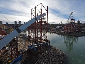 A 500-tonne crane is readied to lift pieces of centre arches for the new Walterdale Bridge in Edmonton on Oct. 22, 2015.