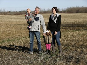 Ken Saunders with his daughter Lindsey Hoefels and grandchildren Tenley and Jake on his land northwest of Edmonton. Saunders is one of a group of landowners trying to negotiate over a new pipeline proposed by Pembina Pipelines.