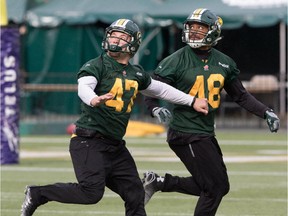 J.C. Sherritt, left, and Blair Smith during Eskimos practice at Commonwealth Stadium in Edmonton Oct. 6, 2015. The Eskimos take on the Stampeders in Calgary this weekend with first place in the CFL West Division on the line.