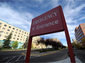 A sign points to the entrance of the emergency department at the Royal Alexandra Hospital.