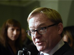 Education Minister David Eggen speaks to media after meeting with members of the Catholic School Board at the Legislature in Edmonton on Wednesday Sept. 23, 2015.