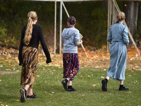 Students walk through the playground at the current Mennonite school in Two Hills, Alta. on Sept. 29, 2015.