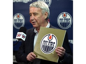 Oilers CEO Bob Nicholson holds the gold card from the 2015 NHL Draft Lottery Draw.