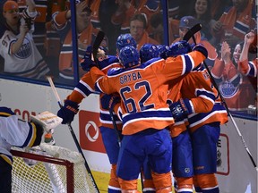 The Edmonton Oilers celebrate their first goal by Lauri Korpikoski (28) against the St. Louis Blues during the home opener at Rexall Place in Edmonton, October 15, 2015.