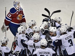 Edmonton Oil Kings goalie Alec Dillon skates past as the Saskatoon Blades celebrate their 3-2 overtime win at Rexall Place in Edmonton, Oct. 21, 2015. It was the Oil Kings' fifth consecutive loss.