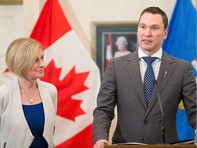 Premier Rachel Notley, left, after appointing Deron Bilous as minister of economic  development and trade during a new cabinet announcement at Government House in Edmonton on Thursday, Oct. 22, 2015.