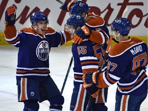 Edmonton Oilers' Mark Letestu (55) celebrates with teammates after scoring against the Detroit Red Wings during NHL action at Rexall Place on Wednesday, Oct. 22, 2015.