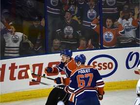 Edmonton Oilers Connor McDavid points toward the Los Angeles Kings net signaling the puck is in the net, but the referee ruled no goal with five seconds left in the third period  at Rexall Place  on Oct. 25, 2015.