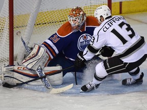 EDMONTON, ALTA: OCTOBER 25, 2015 -- Edmonton Oilers goalie Cam Talbot (33) makes a save on Los Angeles Kings Kyle Clifford (13) during NHL action at Rexall Place in Edmonton, October 25, 2015. (ED KAISER/EDMONTON JOURNAL)