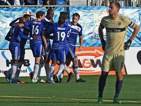 FC Edmonton celebrates a goal by Mallan Roberts (15) against Jacksonville Armada, which tied the game 1-1. FC Edmonton's final NASL game of the season ended in a draw at Clarke Stadium.