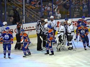 Referee Rob Martell (L) waves off a Edmonton Oilers goal with under 4 seconds to go in the third period against the Los Angeles Kings during NHL action at Rexall Place in Edmonton, October 25, 2015.