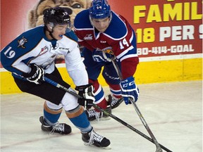 Kootenay Ice's Jared Legien battles Edmonton Oil Kings' Garan Magnes in Western Hockey League action at Rexall Place on Oct. 26, 2015.