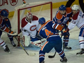 Taylor Hall (4) gets a shot on goalie Carey Price (31) as the Edmonton Oilers storm back to defeat the Montreal Canadiens 4-3 at Rexall Place in Edmonton, Oct. 29, 2015.