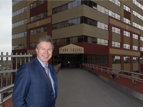 George Schluessel, CEO of Procura Real Estate Services, says the city should come up with an incentive program to encourage owners to repurpose older office buildings to residential. He says new office towers on the way will leave a glut of empty buildings downtown. Schluessel poses for a photo in front of Park Square Apartments, a former office building on Bellamy Hill Road, in Edmonton on Oct. 6, 2015.