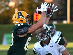 University of Alberta Golden Bears wide receiver Nathan Filipek (83) is unique among Canadian varsity athletes. When he is not playing football, he is an accomplished pole vaulter.