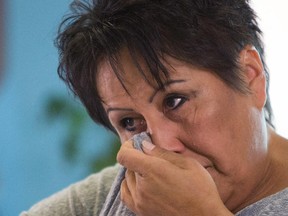 Edna Howard wipes away a tear during an interview. Howard's daughter, Claudia Iron-Howard, was murdered on June 4.