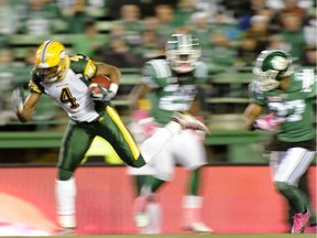 Edmonton Eskimos slotback Adarius Bowman shakes off a tackle en route to scoring a 50-yard touchdown during Saturday's CFL game with the Saskatchewan Roughriders at Mosaic Stadium in Regina on Oct. 24, 2015.