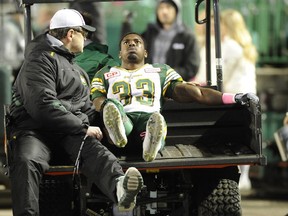 Edmonton Eskimos running back Shakir Bell is helped off the field after hurting his ankle on a 13-yard run in the third quarter against the Saskatchewan Roughriders in Regina on Saturday, Oct. 24, 2015. The injury is not considered serious.