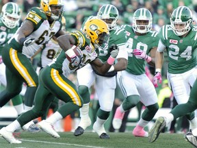 Edmonton Eskimos running back Shakir Bell looks for an opening during first-half CFL action against the Saskatchewan Roughriders in Regina on Saturday, Oct. 24, 2015. The Eskimos won 35-24.