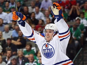 Connor McDavid (97) of the Edmonton Oilers celebrates his first career NHL goal against the Dallas Stars in the second period at American Airlines Center on Oct. 13, 2015 in Dallas.