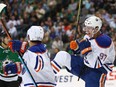 Connor McDavid (97) of the Edmonton Oilers celebrates his first career NHL goal against the Dallas Stars in the second period at American Airlines Center on October 13, 2015 in Dallas, Texas.
