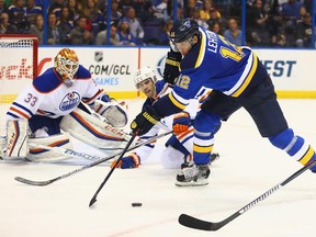 Jori Lehtera of the St. Louis Blues looks to shoot the puck against Goalie Cam Talbot and Justin Schultz of the Edmonton Oilers at the Scottrade Center on Oct. 8, 2015 in St. Louis,.