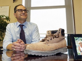 EDMONTON, ALBERTA: OCTOBER 26, 2015 -Joe Ceci, Alberta Minister of Finance and President of Treasury Board prepares for the province's budget release on October 26, 2015 by displaying his late father's work boots. (PHOTO BY LARRY WONG/EDMONTON JOURNAL)