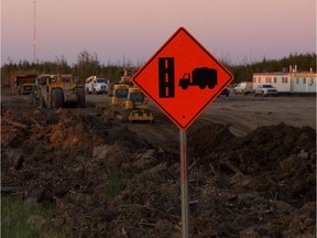 Construction crews work on twinning Highway 63 in northern Alberta,  south of Fort McMurray, on Sept. 7, 2013.