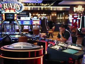 In this Sept. 24, 2015, photo, a man plays an electronic roulette game at a casino in Las Vegas.