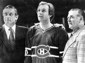 Three eras of the Montreal Canadiens are pictured at the Forum in Montreal, Que., on April 12, 1979. From left, Jean Beliveau (1950s and 1960s), Guy Lafleur (1970s) and Maurice "Rocket" Richard (1940s and 1950s). Former Montreal Canadiens star Jean "Gros Bill" Beliveau died Tuesday at the age of 83.