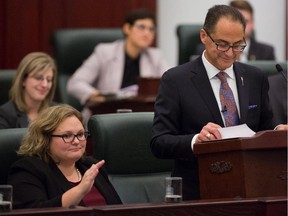 Sarah Hoffman, Minister of Health and Minister of Seniors, sits beside Finance Minister Joe Ceci during the release of the 2015 provincial budget in Edmonton on Tuesday, Oct. 27, 2015.
