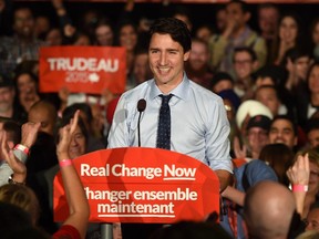 Liberal leader Justin Trudeau speaks to supporters during a final Campaign stop at the Maharaja Banquet Hall in Edmonton on Oct. 18, 2015.