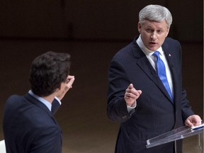 Liberal Leader Justin Trudeau and Conservative Leader Stephen Harper point fingers and trade words during the Sept. 28, 2015 Munk Debate on foreign affairs in Toronto.