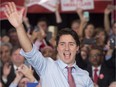 Prime minister-designate Justin Trudeau waves to supporters as he steps onto the stage during a welcome rally in Ottawa, on Tuesday, Oct. 20, 2015.