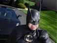In this March 27, 2012, photo, Leonard Robinson dresses as Batman outside his home, in Owings Mills, Md.