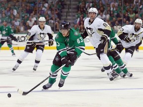 DALLAS, TX - OCTOBER 08:  Ales Hemsky #83 of the Dallas Stars controls the puck against Brian Dumoulin #8 of the Pittsburgh Penguins in the first period at American Airlines Center on October 8, 2015 in Dallas, Texas.